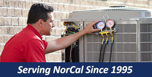 A man working on an air conditioner unit.